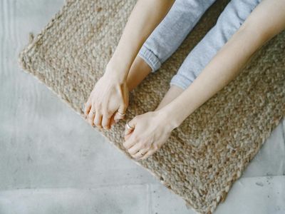 Close-up of a person's feet on a yoga mat.